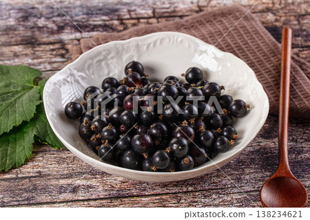 Sweet juicy Black currants berries 138234621