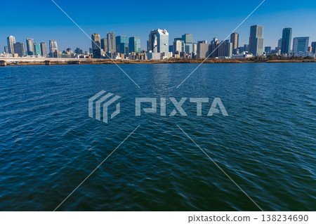 Osaka City: The Yodo River and the skyscrapers of Osaka Umeda on a clear winter day. Osaka City: The Yodo River and the skyscrapers of Osaka Umeda on a clear winter day. 138234690