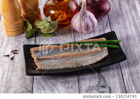 Marinated salted herring fillet slices Marinated salted herring fillet slices 138234743