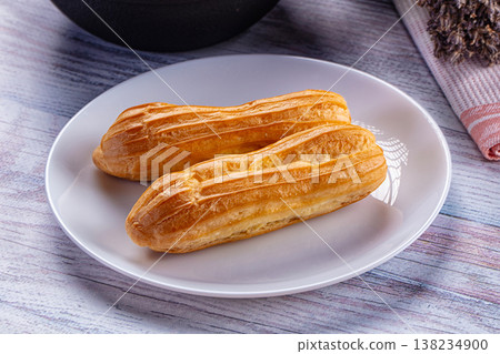 Sweet baked eclair dessert with cream Sweet baked eclair dessert with cream 138234900