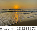 Golden sunrise over ocean waves on sandy beach tropical seascape Vietnam travel background 138235673