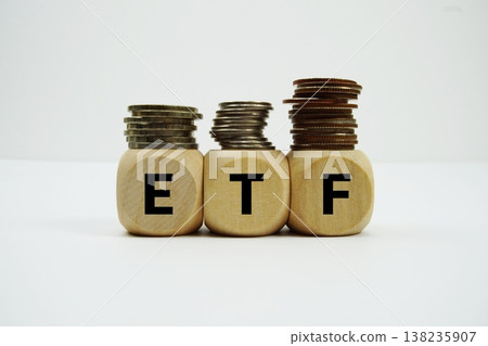 Stack of coins with wood blocks with "ETF (Exchange Traded Fund)" Financial concept Stack of coins with wood blocks with "ETF (Exchange Traded Fund)" Financial concept 138235907