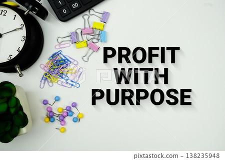 Profit With Purpose message with calculator, alarm clock and Stationery on white background Profit With Purpose message with calculator, alarm clock and Stationery on white background 138235948