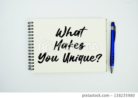 What Makes You Unique? message written on notepad with pen on white background 138235980