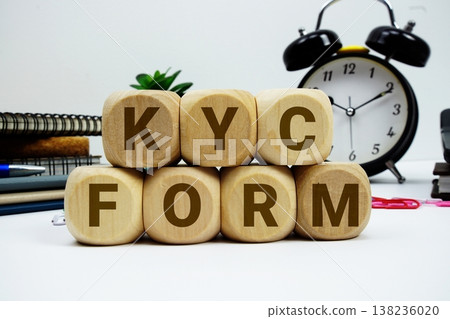 KYC Form alphabet letters with calculator and alarm clock on white background 138236020