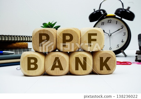 PPF Bank alphabet letters with calculator and alarm clock on white background 138236022