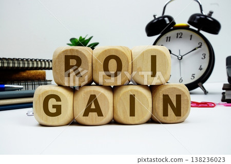 ROI Gain alphabet letters with calculator and alarm clock on white background 138236023