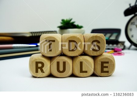 TDS Rule alphabet letters with calculator and alarm clock on white background TDS Rule alphabet letters with calculator and alarm clock on white background 138236083