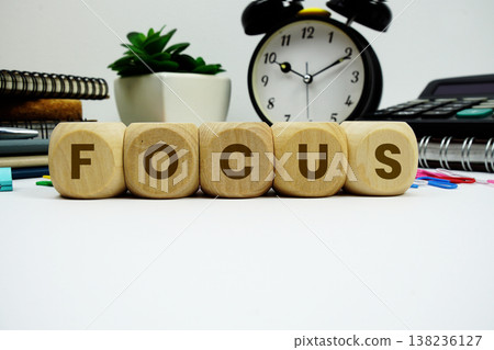 FOCUS alphabet letters with alarm clock and calculator on white background 138236127