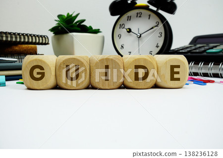 GUIDE alphabet letters with alarm clock and calculator on white background 138236128