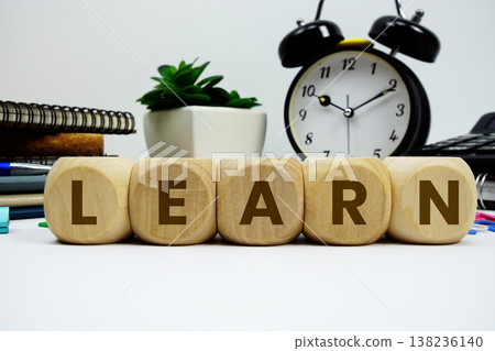 LEARN alphabet letters with alarm clock and calculator on white background LEARN alphabet letters with alarm clock and calculator on white background 138236140