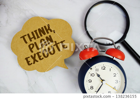 Think, Plan, Execute text with magnifying glass and alarm clock on marble background 138236155