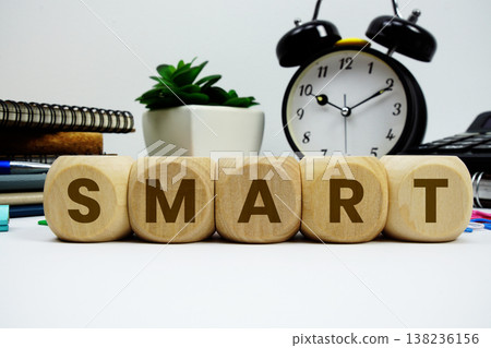 SMART alphabet letters with alarm clock and calculator on white background 138236156