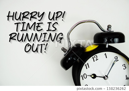 Hurry Up! Time is Running Out! text with alarm clock flat lay on white background 138236262