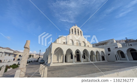 White church exterior with arched walls and columns 138236277