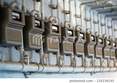 Curves of the gas pipe on the background wall. Multiple city gas meters. Korea 138236295