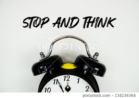 Stop and Think text with alarm clock flat lay on white background 138236368