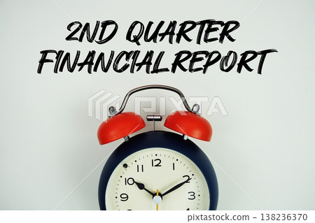 2nd Quarter Financial Report text with alarm clock flat lay on white background 138236370
