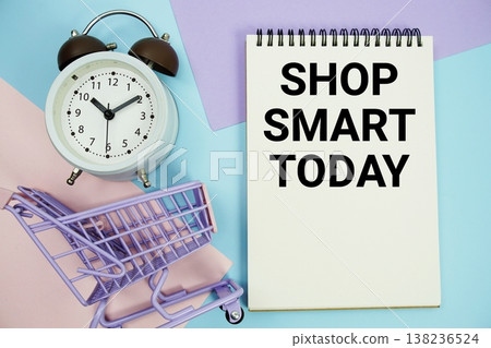 Shop Smart Today text written on notepad with alarm clock and trolley shopping cart Shop Smart Today text written on notepad with alarm clock and trolley shopping cart 138236524
