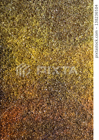 Abstract background of coloured vibrant chalk dust on black background chalky grit texture 138236584