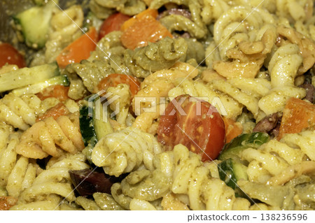 Close up of pasta pesto with salad vegetables 138236596
