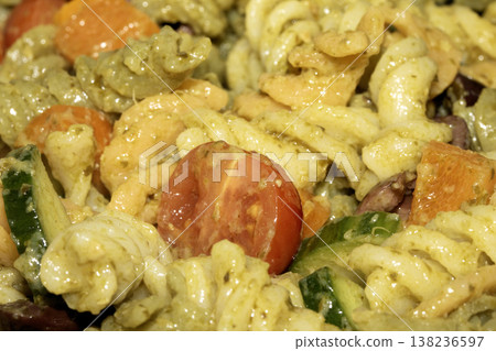 Close up of pasta pesto with salad vegetables 138236597