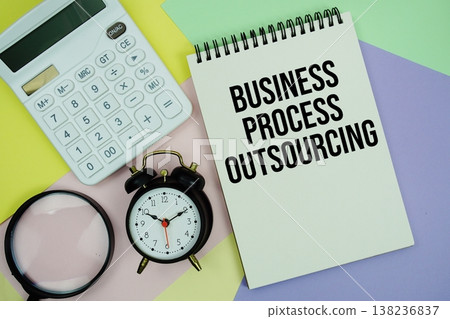 Business Process Outsourcing text with calculator, alarm clock and magnifying glass Business Process Outsourcing text with calculator, alarm clock and magnifying glass 138236837