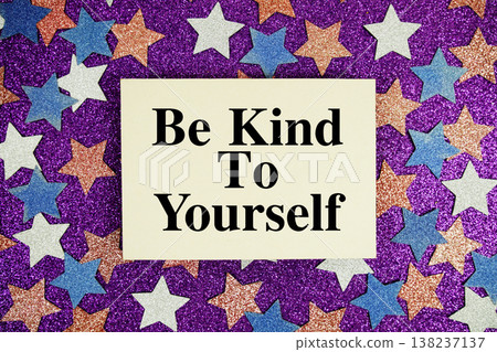 "Be Kind To Yourself" quotes on paper card with purple glitter background with white, pink and blue stars 138237137
