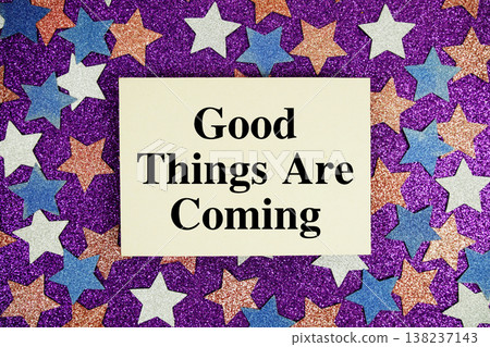 "Good Things Are Coming" quotes on paper card with purple glitter background with white, pink and blue stars "Good Things Are Coming" quotes on paper card with purple glitter background with white, pink and blue stars 138237143