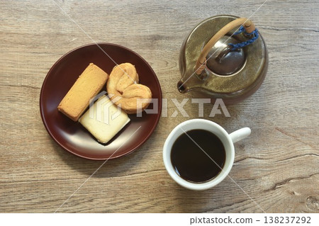 assorted sweet dessert pineapple pie and butterfly pie with black coffee cup on table assorted sweet dessert pineapple pie and butterfly pie with black coffee cup on table 138237292