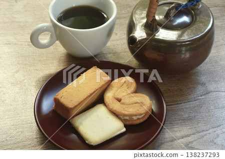 assorted sweet dessert pineapple pie and butterfly pie with black coffee cup on table assorted sweet dessert pineapple pie and butterfly pie with black coffee cup on table 138237293