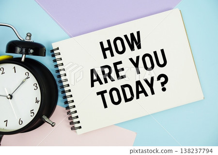 How Are You Today? text written on notepad with alarm clock flat lay on multicolor pastel background 138237794