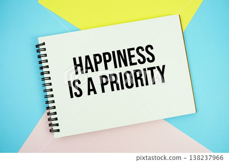 Happiness is a Priority text written on notepad flat lay on multicolor pastel background Happiness is a Priority text written on notepad flat lay on multicolor pastel background 138237966