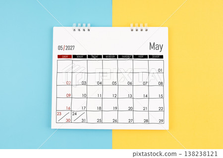 May 2027 calendar on blue and yellow background, Flat lay. May 2027 calendar on blue and yellow background, Flat lay. 138238121