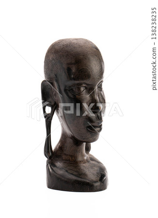 Sculpture of human head, African origin, weathered texture, serene gaze Sculpture of human head, African origin, weathered texture, serene gaze 138238235