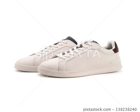 Stylish white leather sneakers, perfect for modern streetwear or retail catalogs Stylish white leather sneakers, perfect for modern streetwear or retail catalogs 138238240