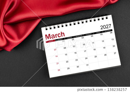 March 2027 Monthly desk calendar with red silk on black leather background. March 2027 Monthly desk calendar with red silk on black leather background. 138238257