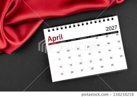 April 2027 Monthly desk calendar with red silk on black leather background. April 2027 Monthly desk calendar with red silk on black leather background. 138238258