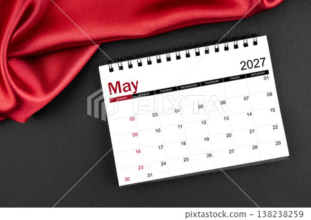 May 2027 Monthly desk calendar with red silk on black leather background. May 2027 Monthly desk calendar with red silk on black leather background. 138238259