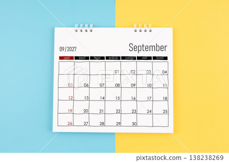 September 2027 calendar on blue and yellow background, Flat lay. September 2027 calendar on blue and yellow background, Flat lay. 138238269