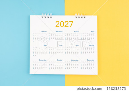 Yearly calendar 2027 on blue and yellow background, Flat lay. 138238273