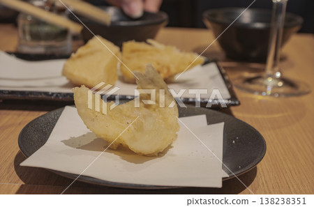 The craftsmanship of the chef shines through in the freshly fried tempura of Japanese whiting and the scene at the dinner table. The craftsmanship of the chef shines through in the freshly fried tempura of Japanese whiting and the scene at the dinner table. 138238351