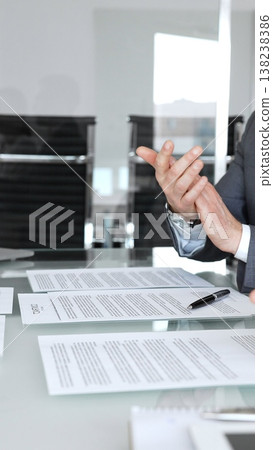 Group of business professionals in a modern office meeting clapping hands and celebrating success after signing a new contract. Concept of teamwork, achievement, partnership, and corporate success Group of business professionals in a modern office meeting clapping hands and celebrating success after signing a new contract. Concept of teamwork, achievement, partnership, and corporate success 138238386