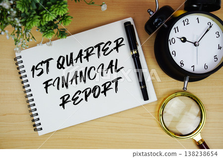 1st Quarter Financial Report text written on notepad with alarm clock and magnifying glass flat lay on wooden background 1st Quarter Financial Report text written on notepad with alarm clock and magnifying glass flat lay on wooden background 138238654