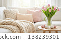 Cozy living room with white sofa, pink tulips, and Easter decor Cozy living room with white sofa, pink tulips, and Easter decor 138239301