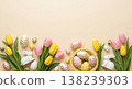 Easter eggs in basket with tulips and bunnies on beige background Easter eggs in basket with tulips and bunnies on beige background 138239303