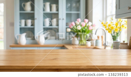 Blurred kitchen interior with wooden countertop and flowers 138239313