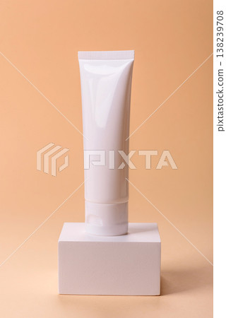 A white empty plastic or aluminum tube for cream, paste as a mockup. An empty cosmetic tube mockup 138239708
