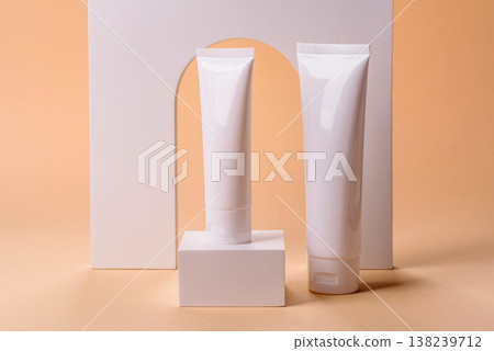 A white empty plastic or aluminum tube for cream, paste as a mockup. An empty cosmetic tube mockup A white empty plastic or aluminum tube for cream, paste as a mockup. An empty cosmetic tube mockup 138239712