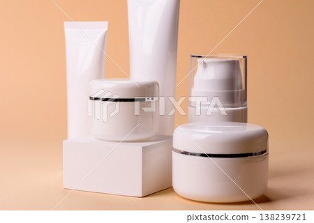A set of empty white plastic or aluminum jars, tubes as mockup. Empty cosmetic jar and tube mockups 138239721